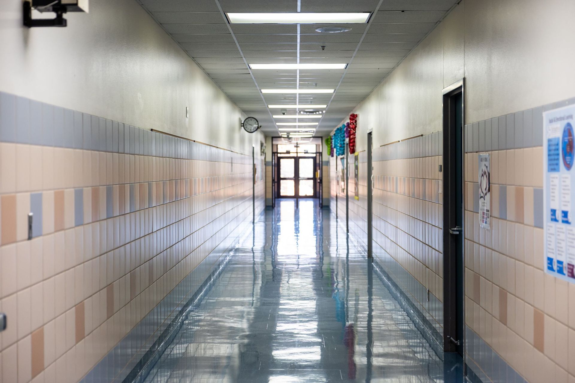 An empty, brightly lit school corridor